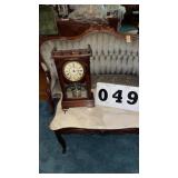 vintage wooden mantel or shelf clock, resembling