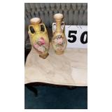 Pair of appears to show an antique double-handled