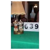 vintage porcelain figural table lamp featuring a