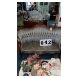 vintage Victorian-style carved wooden loveseat