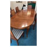 vintage wood dining table and cane-back chairs in