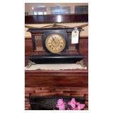 antique Victorian-style shelf or mantel clock