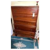appears to be a vintage solid cherry tall chest