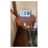 vintage wooden side table or nightstand featuring