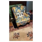 vintage armchair features a charming blue and