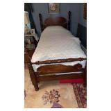 Matching pair of antique four-poster wooden twin