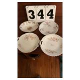 3 antique serving plates and one glass bowl.