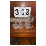 appears to be an antique clear glass creamer
