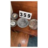 appears to be an antique pewter plate or charger