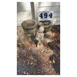 2 concrete planters and concrete figure.