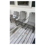 4 non-matching patio wrought iron chairs and 1