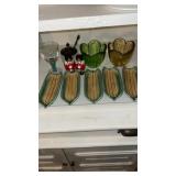 6 corn on the Cobb trays, salt and pepper and 3