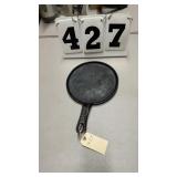 antique cast-iron round hand griddle or skillet