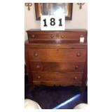 an antique country-style bureau or chest of
