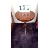 vintage round wooden accent table with a turned