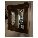 Wall mirror with racks.
