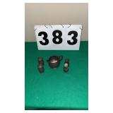 4 salt and pepper shakers and creamer appears to