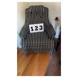 vintage armchair features a bold black-and-cream