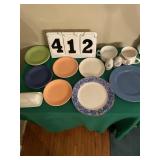 2 odd cups, 7 odd plates, butter dish, salt and