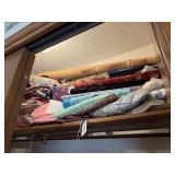 Shelf of assorted fabric