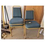 Two Metal Frame Upholstered Stacking Chairs