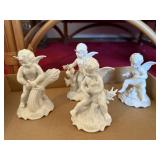Four White Ceramic Angel Figurines