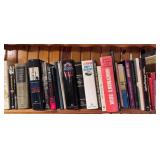 Collection of Assorted Books on Top Shelf