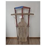 Red Metal and Wood Sled