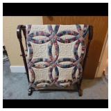 Double Wedding Ring Quilt on Wood Rack