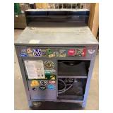 Gray Metal Work Station with Integrated Shelving and Attached Hardware