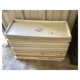 Stack of White Plastic Meat Trays 30x13