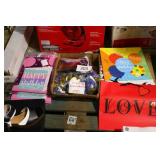 lot of gift bags, balloons and banners