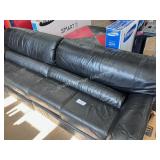 one black leather couch