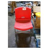 4 red plastic and metal chairs