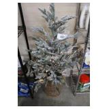 lighted artificial flocked tree w/wicker basket