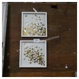 2 gold butterflies in frame