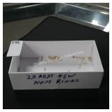 23 new asst nose rings (display)