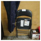 black folding chair - back is cut