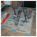 skid of cordless dyson parts