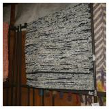 navy/white area rug (size unknown)