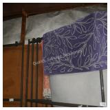 purple area rug (size unknown)