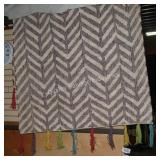 purple area rug  (size unknown)