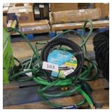 2 water hoses and pressure washer hose