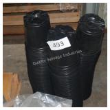 3 stacks of black planters