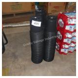 3 stacks of black planters