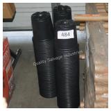 3 stacks of black planters