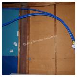 3 blue dented pipes