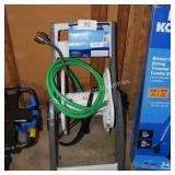 hose reel w water hose and sprayer