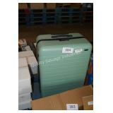 green luggage rolling bag