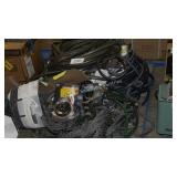 skid of water hoses and sprayer